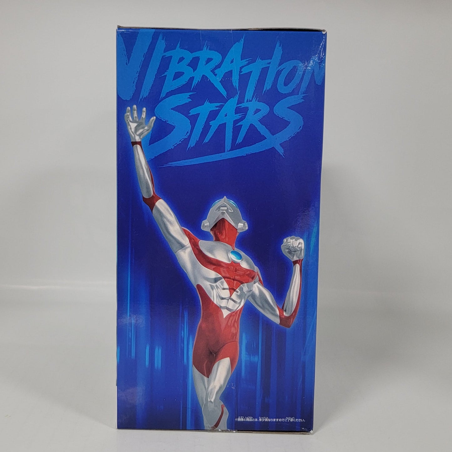 Product packaging with a blue background and a graphic of a person in a red outfit.
